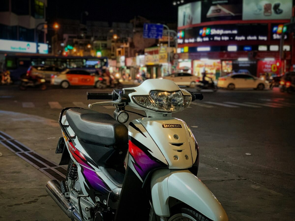white and black motor scooter