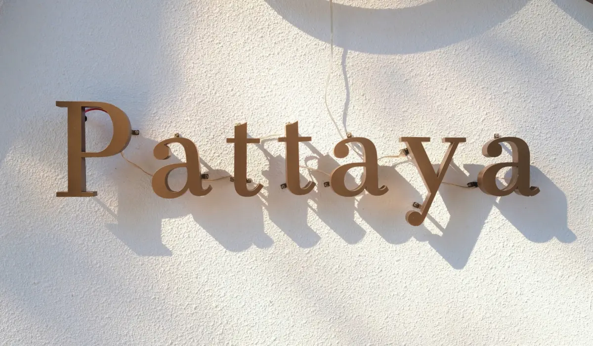 a sign that reads pataya on the side of a building