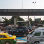 a bunch of cars that are in a parking lot