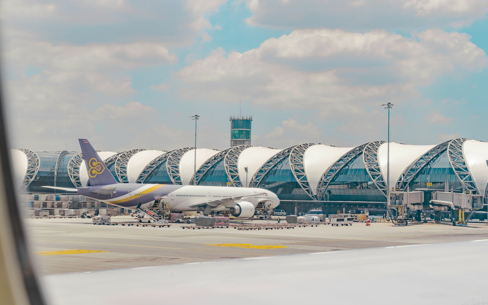 a large jetliner sitting on top of an airport tarmac